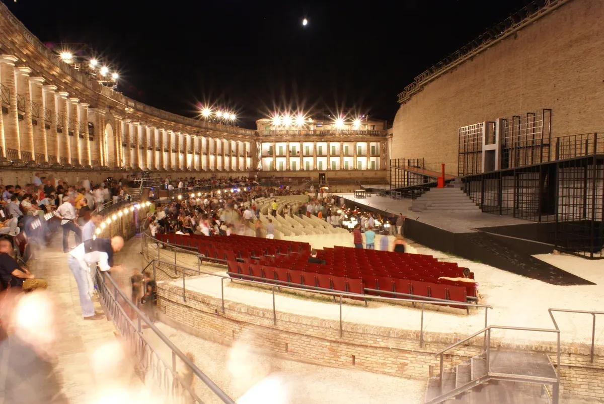 The Sferisterio arena in Macerata by night, opera festivals in Italy, opera houses in Italy