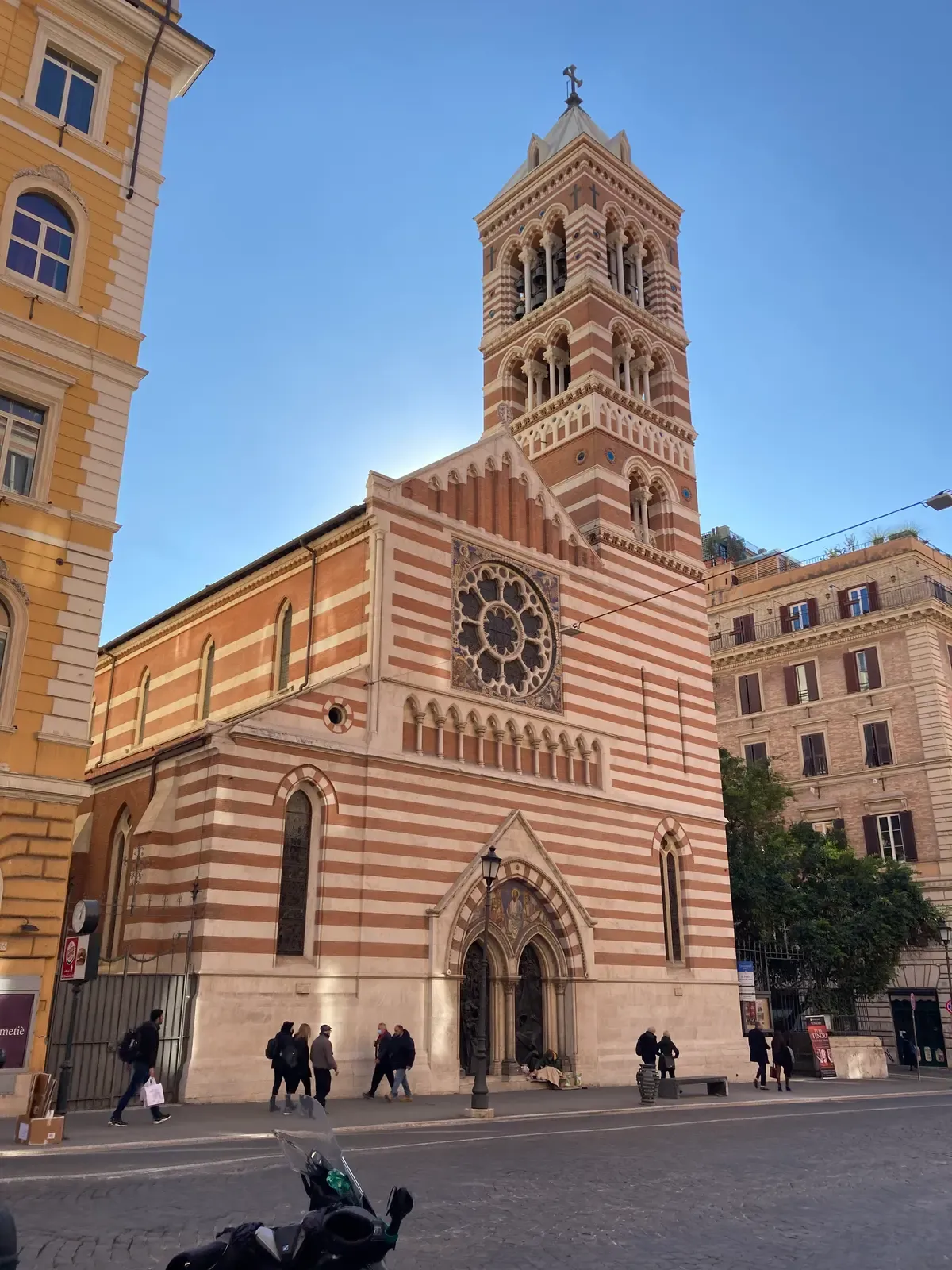 The striped Gothic Revival front of St Paul's Within the Walls, opera in Rome, opera houses in Italy